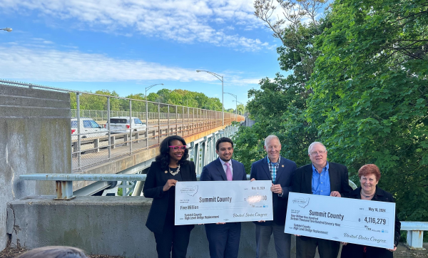 Image of Congresswoman Emilia Sykes presents two checks totaling $9.1 Million for the funding of the High Level Bridge Design